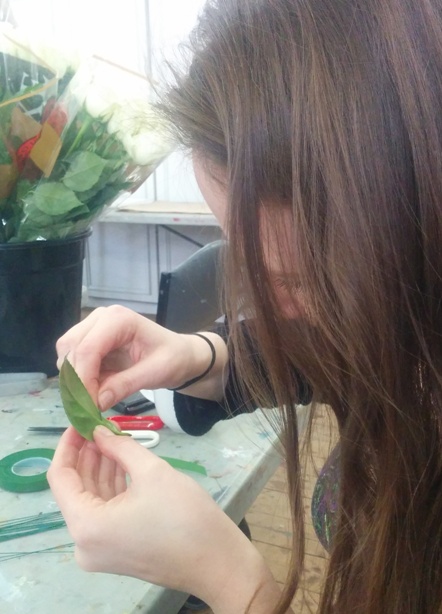 Rach creating a rose corsage